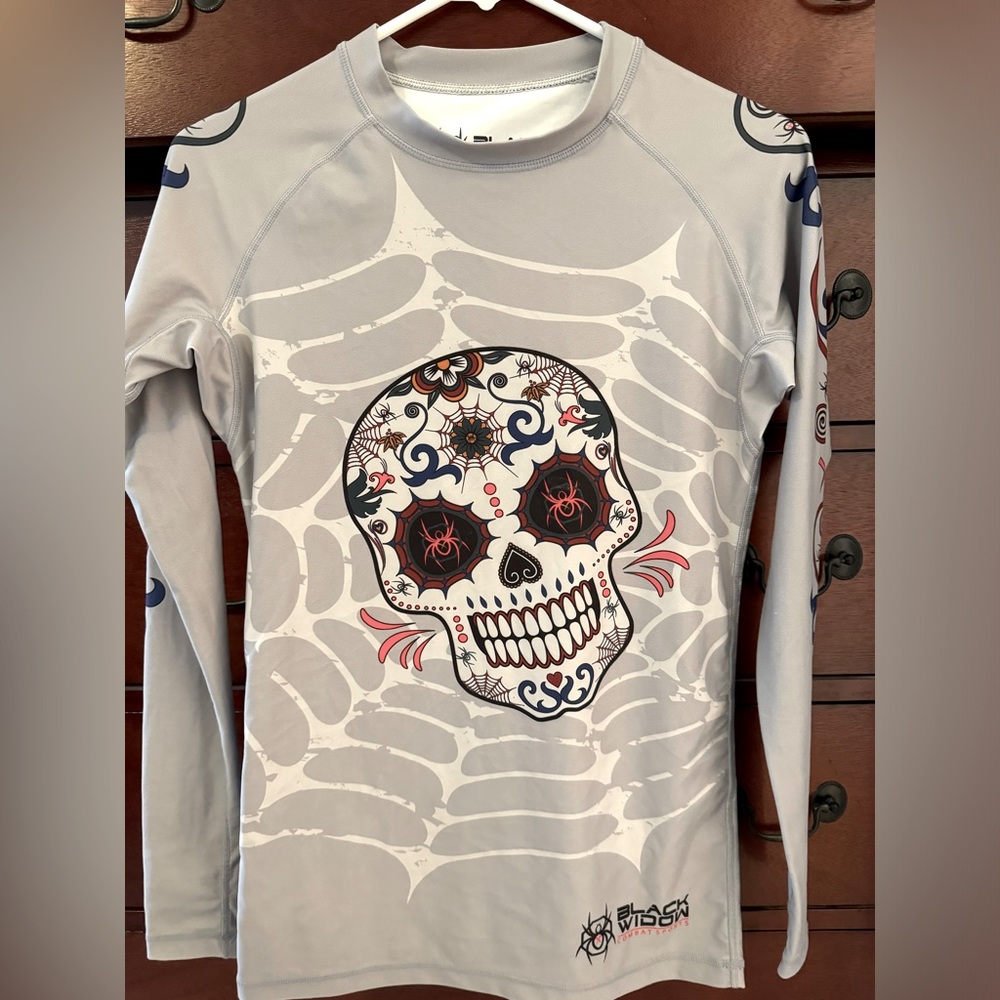 Women’s Black Widow Combat long sleeve rashguard. Sugar skull design. Worn once